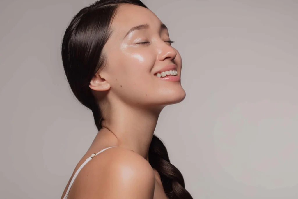 Woman showing a defined jawline after under-chin fat removal in Mount Kisco, NY